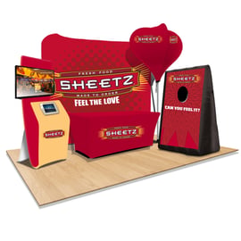 Indoor Event Booth with Monitor Stands and Inflatable Carnival Game