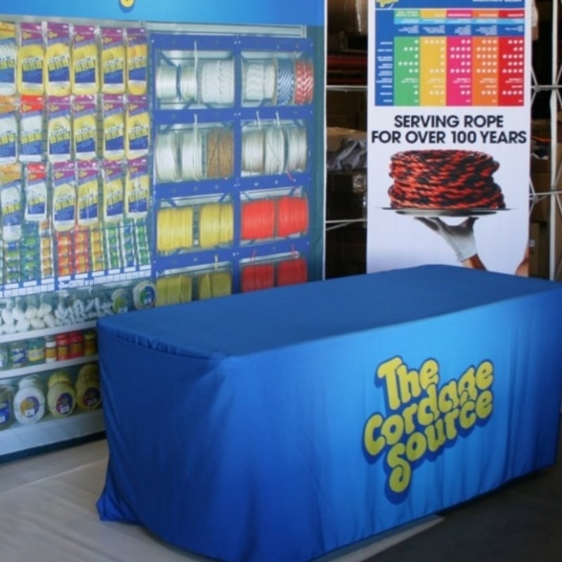 Custom Table Top Covers with Banners behind for The cordage source from above all advertising